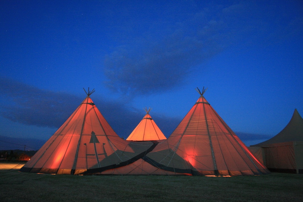 Large event tipis at night