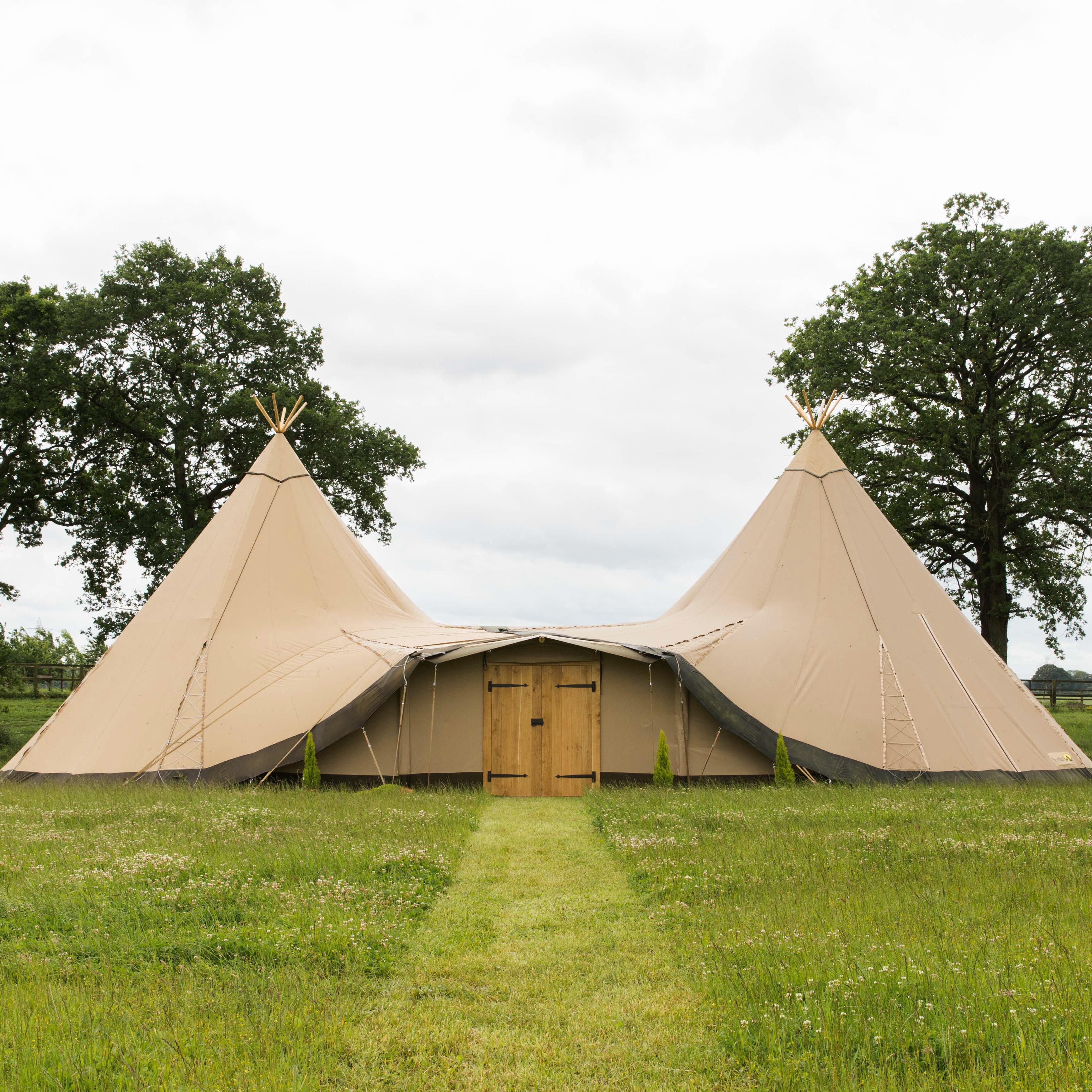 Tipi with canvas porch and wooden doors