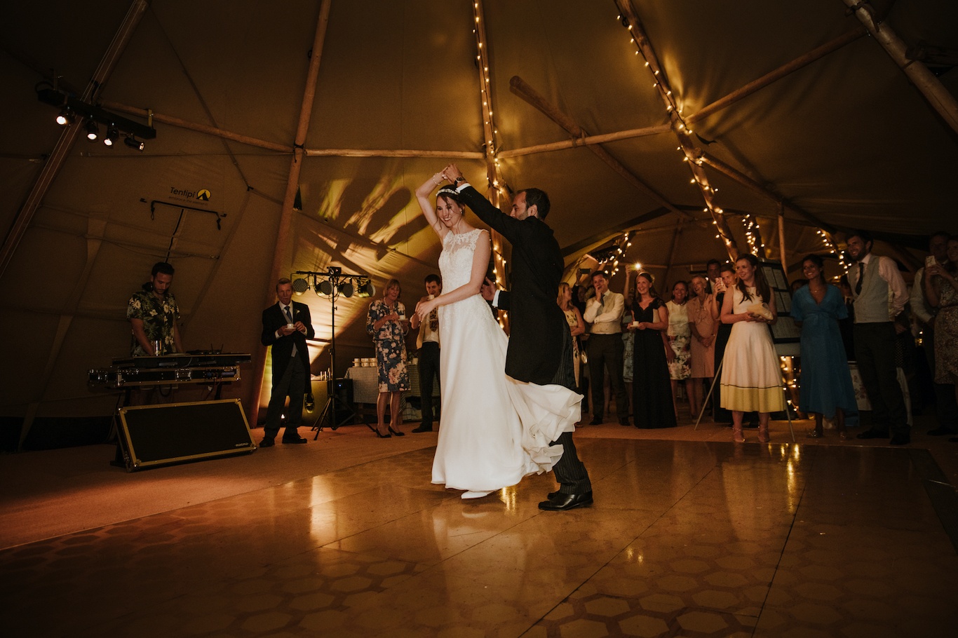Bride and Groom dancing in a tipi