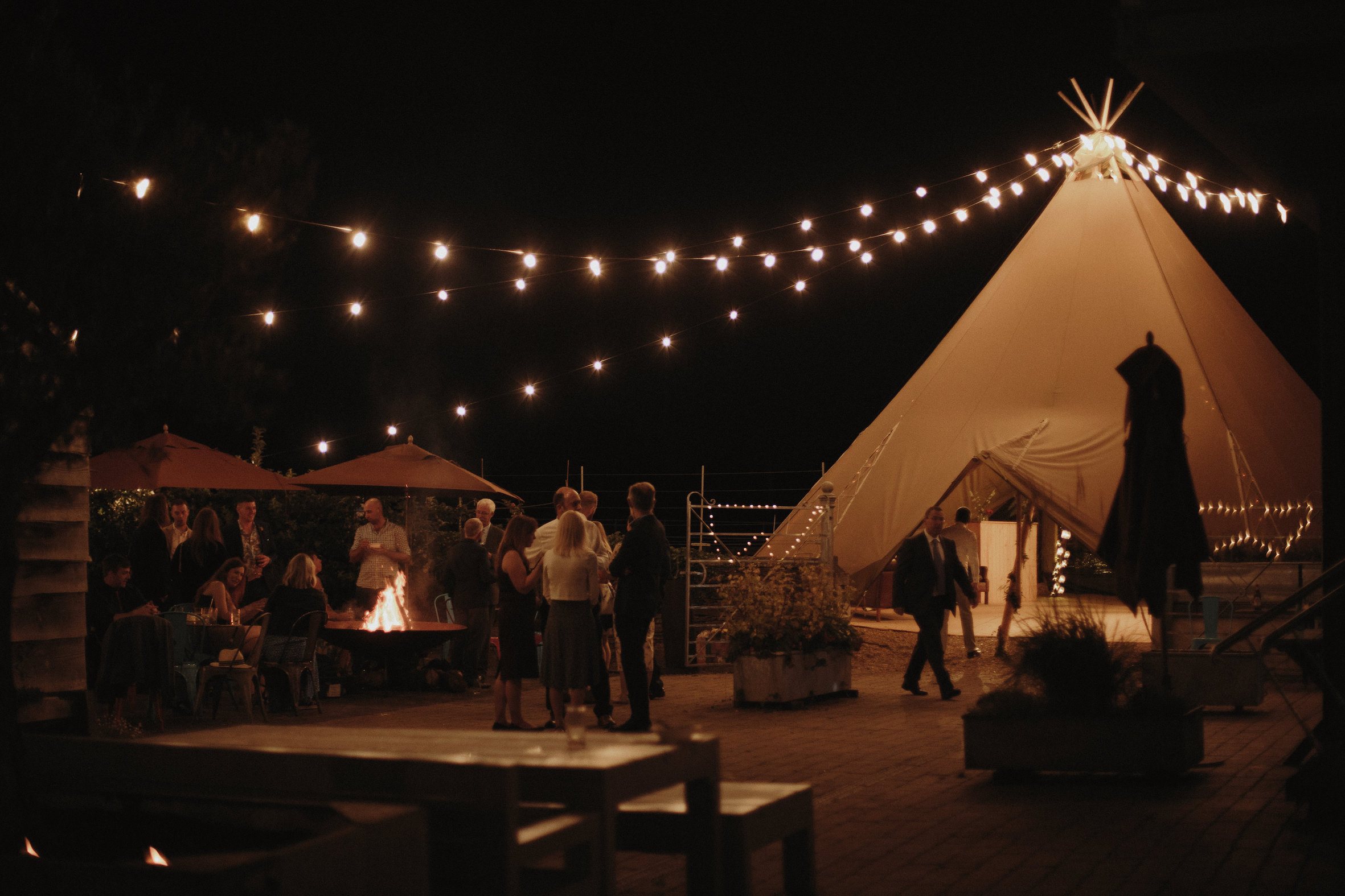 Country wedding - Fire pit and festoon tipi lighting