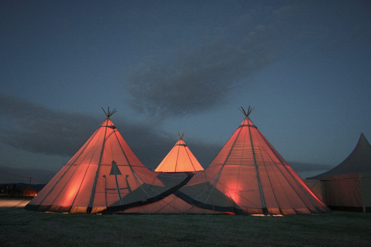 tipis lit from inside at night