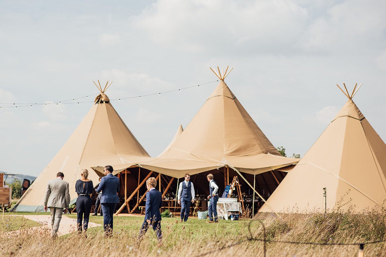 guests in front of wedding tipis