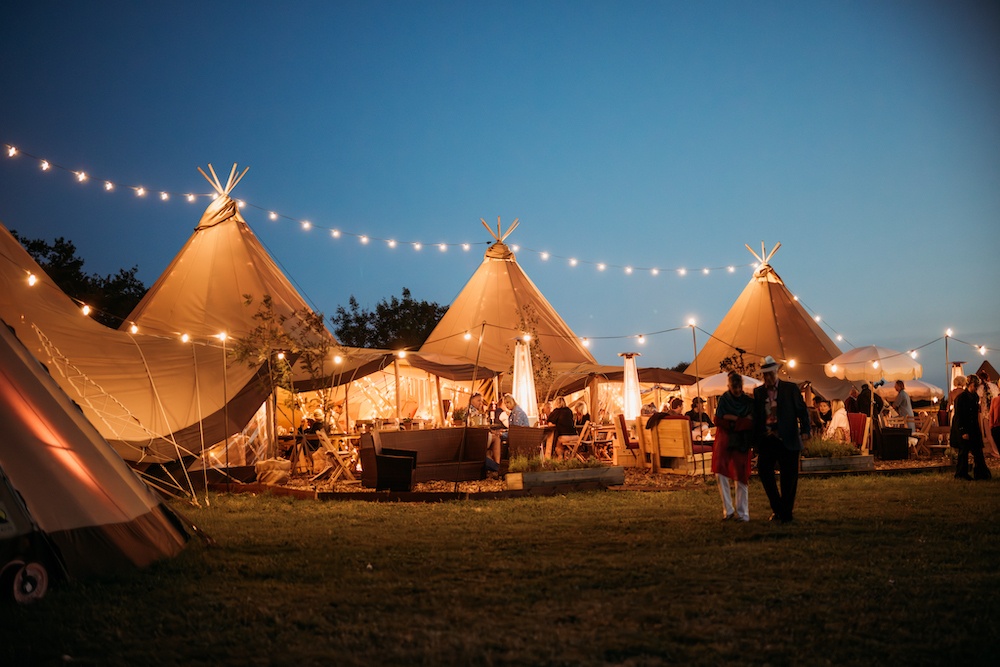 Tipi with lighting at night at Glastonbury Festival - Buffalo Tipi and Marquee hire - West Country and Cotswolds